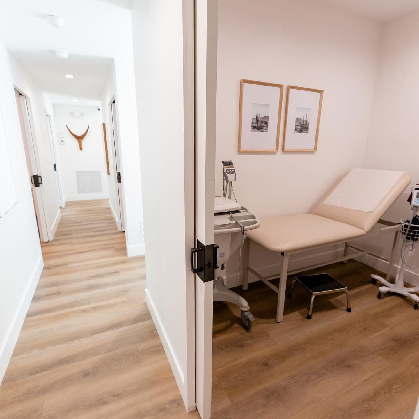Hallway leading to an exam room with an exam table