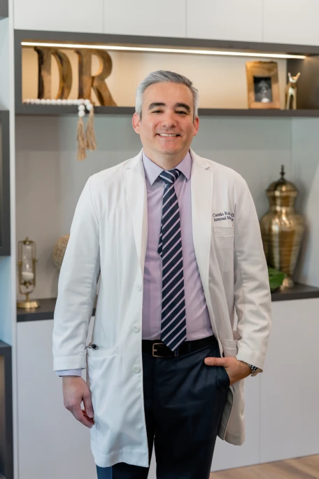 Dr. Camilo Ruiz, DO, FACOI, FAASM, board-certified sleep and internal medicine physician